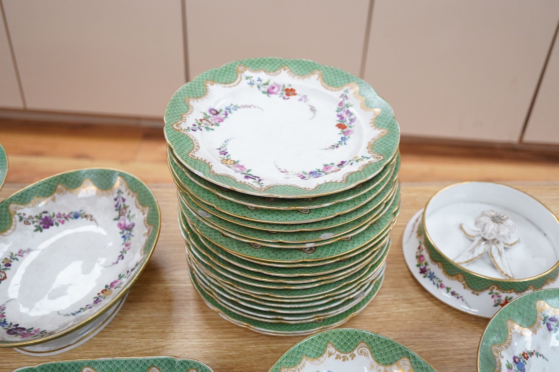 A 19th century French Paris porcelain part dessert service with green scale borders by Nast Paris, largest 26cm wide